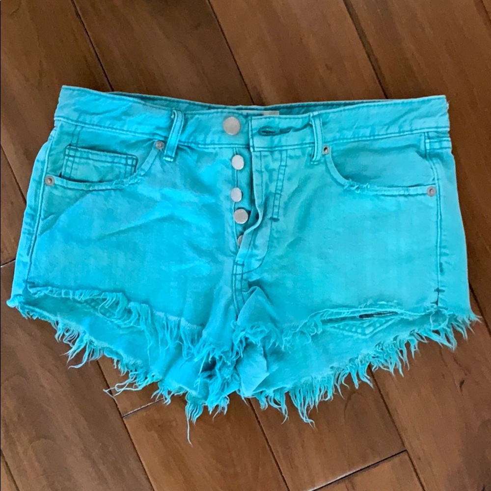 Free People distressed teal denim shorts